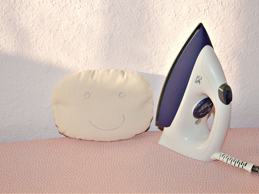 image of a diy tailors ham near a sewing iron