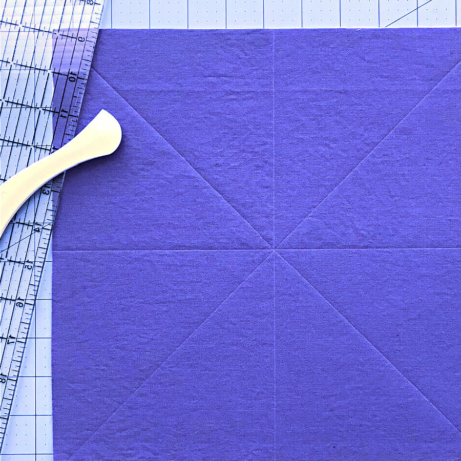 hera marker on a piece of fabric with marks on it. a ruler in the background