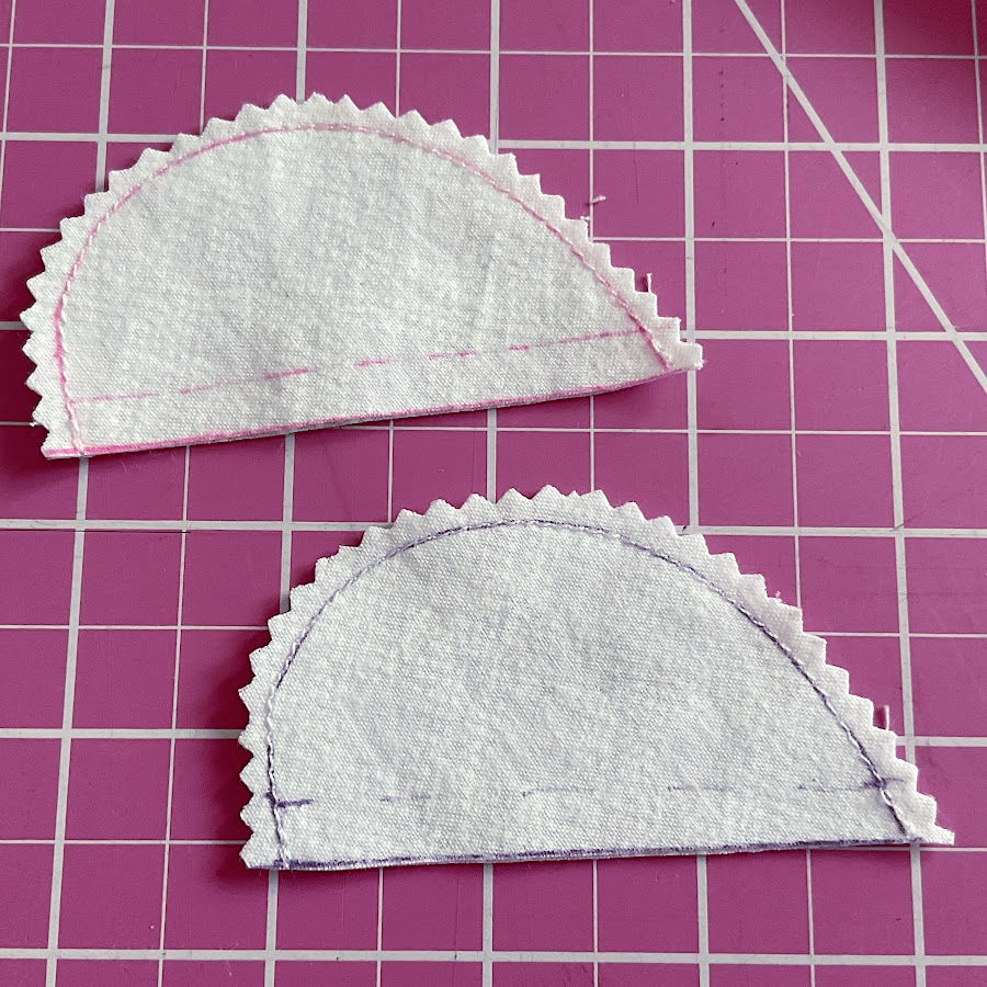 fabric angels wings after being cut the round cut is made with pinking shears to make it easier to turn right side out