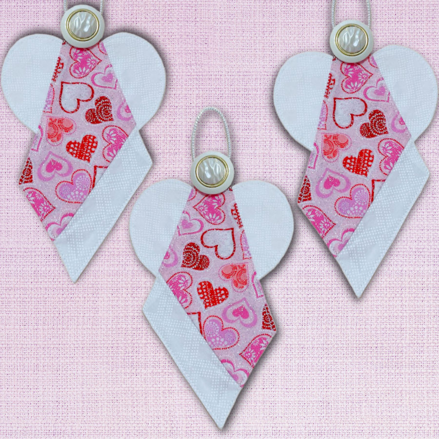 three finished fabric angels