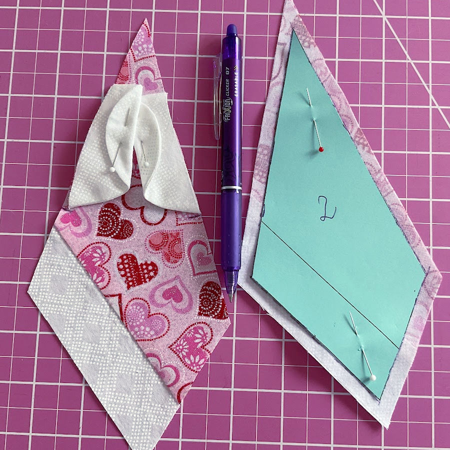 marking the stitching line using the pattern piece number two on the wrong side of one of the fabric angels pieces prepared before