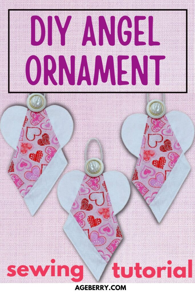 Three handmade fabric angel ornaments with white wings, pink heart-patterned bodies, and pearl button heads displayed on a soft pink textured background. Text reads “DIY Angel Ornament - sewing tutorial - ageberry.com.”