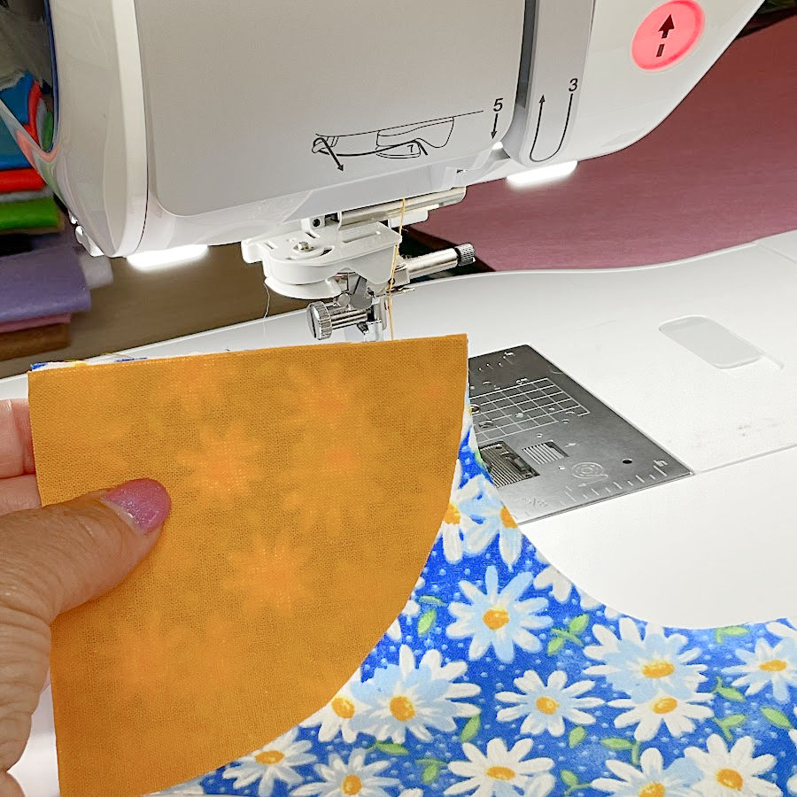 image showing the correct alignment of the two matching quarter circle shapes before sewing