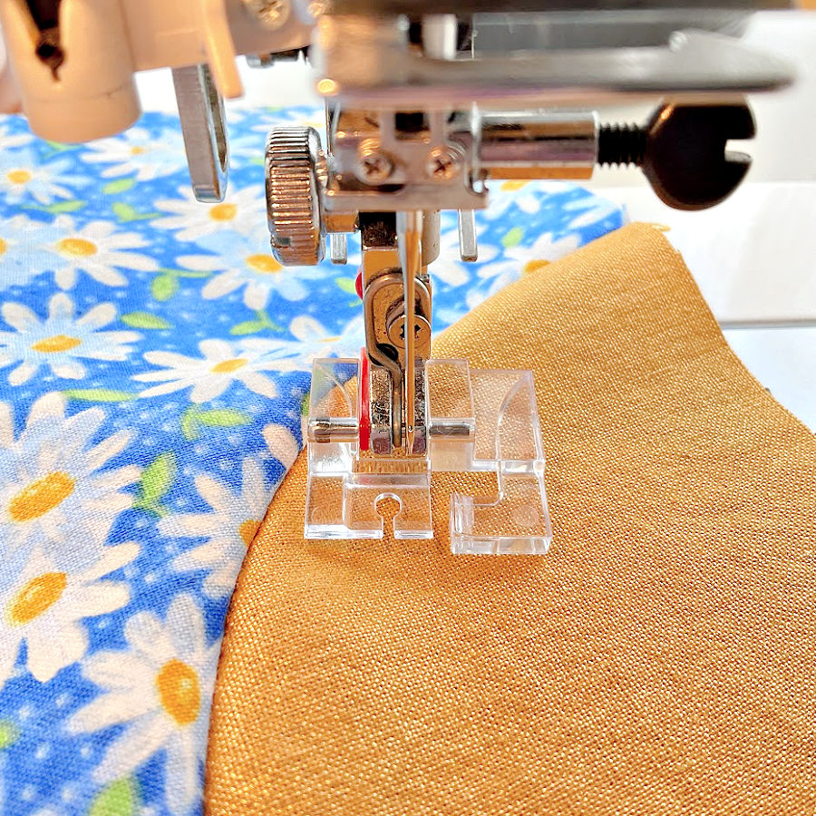 curve master presser foot mounted on a sewing machine does not aloign with the needle hole without adjustment