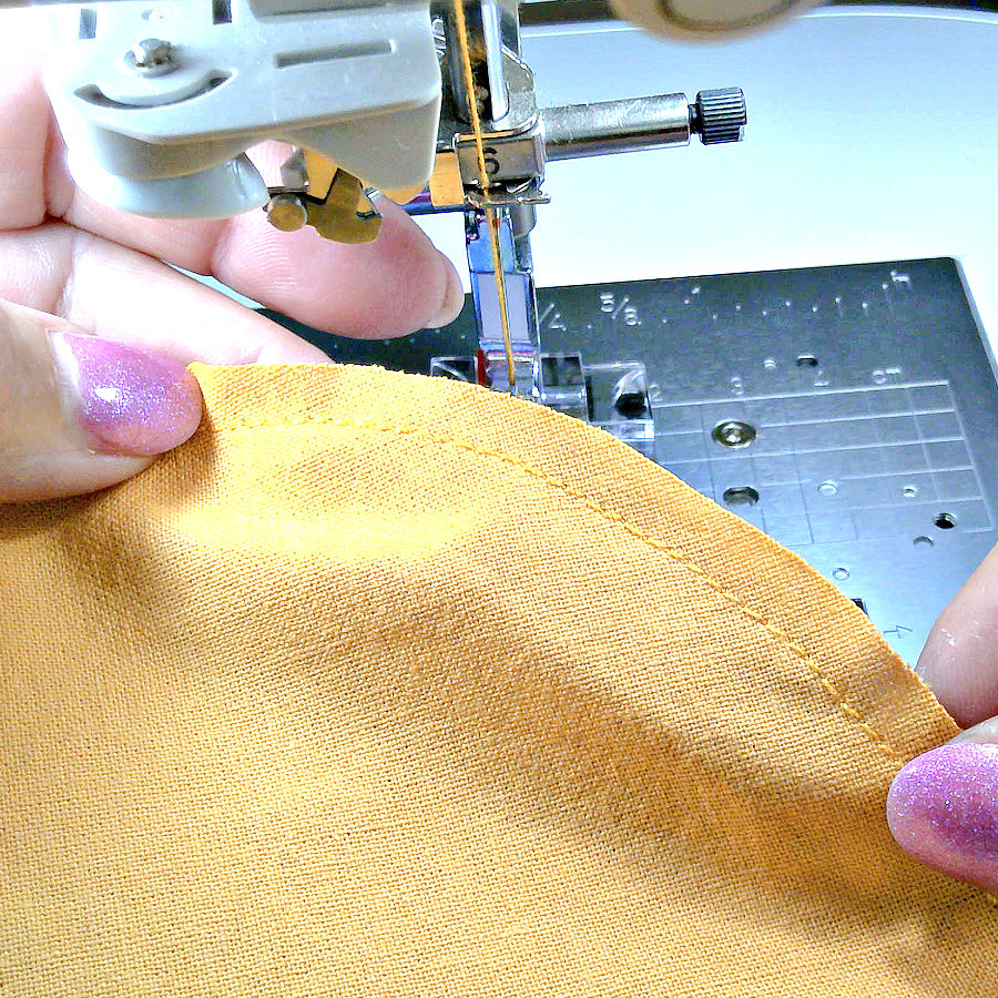 the seam allowances of the two pieces of fabric match after carefully aligning the pieces of fabric with the seam guide on the foot
