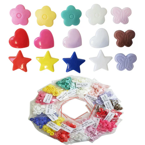 kam snaps of various shapes star heart butterfly and various colors red pink green is white blue brown