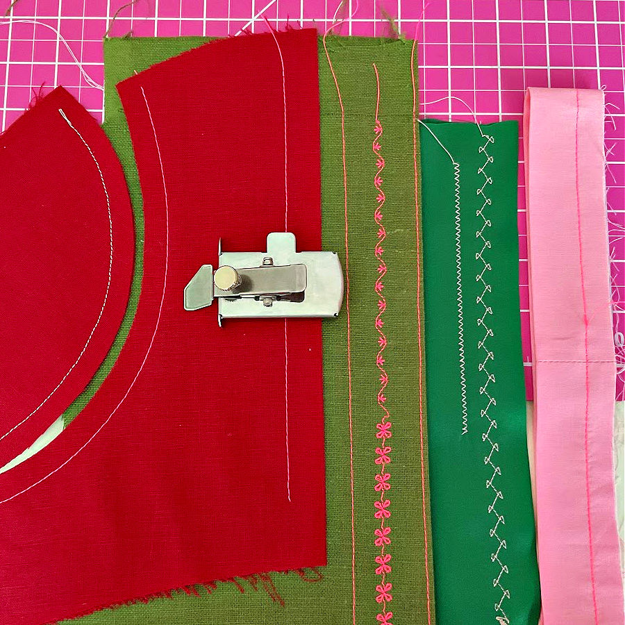 magnetic seam guide on top of pieces of fabric of various colors showing all types of stitches that were executed using the seam guide