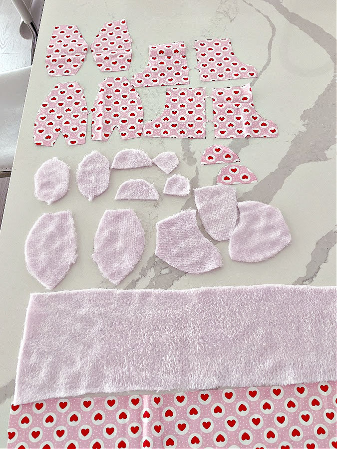 all pieces for the memory bear cut in the required numbers two pieces of leftover fabric also