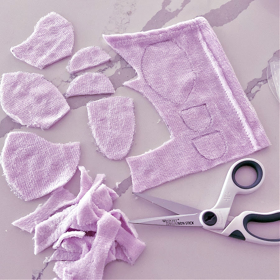 pieces for the head of the bear after being cur from minky fabric remaining scrap pieces also shown