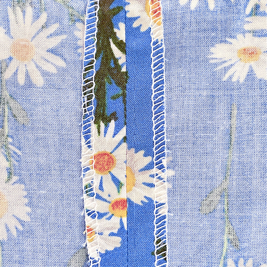 example of an three thread overlock stitch which secures the fabric edge