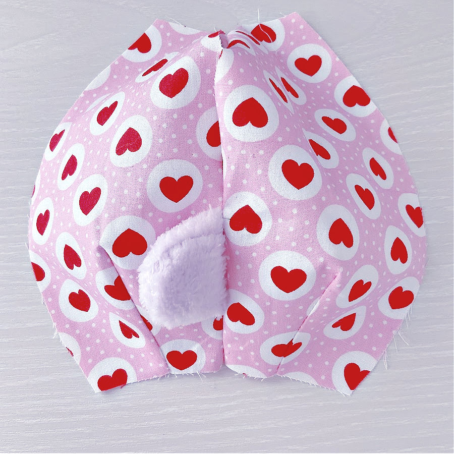memory bear body back sewn together with the tail positioned properly and with a gap left for a later turn over