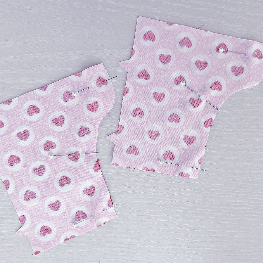 pieces for the legs of the bear pinned together before stitching