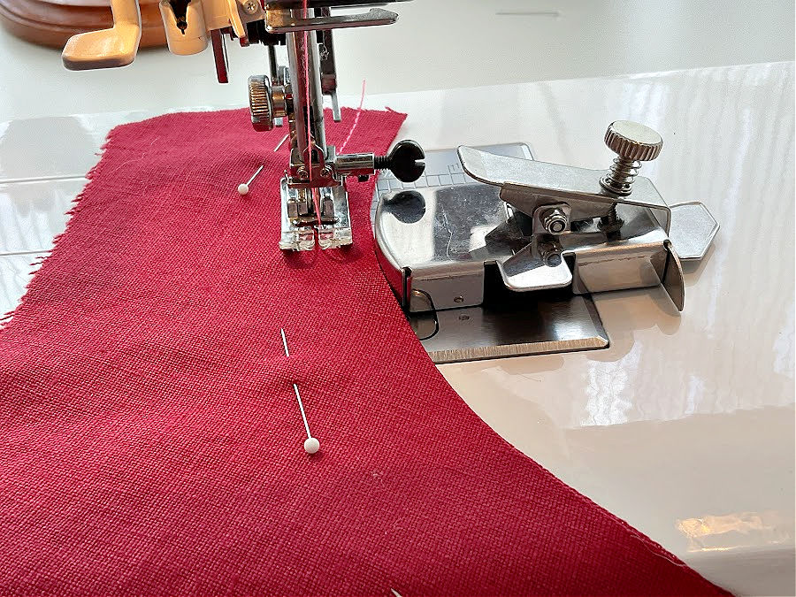 the seam guide installed on a sewing machine for a curved seam the needle assembly is in line with the center line of the guide