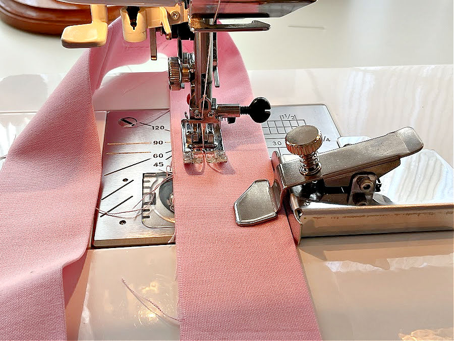 the magnetic seam guide installed on a sewing machine in preparation for sewing a loop of fabric