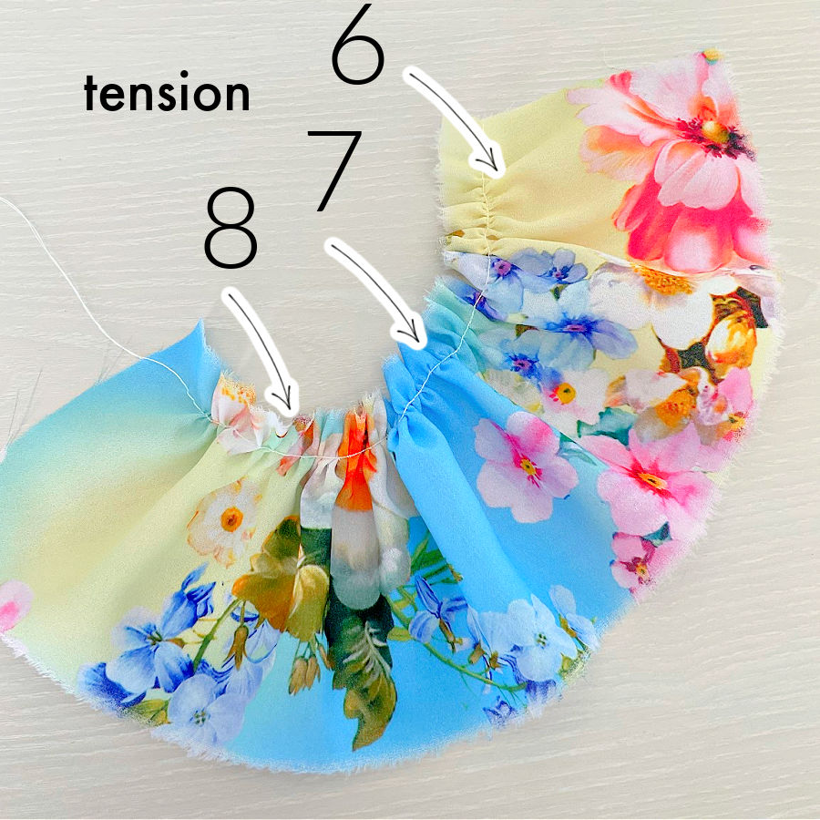 the effect of tension on gathers when using the gathering foot on a piece of multi colored polyester crepe the higher the tension the more dense the gathers