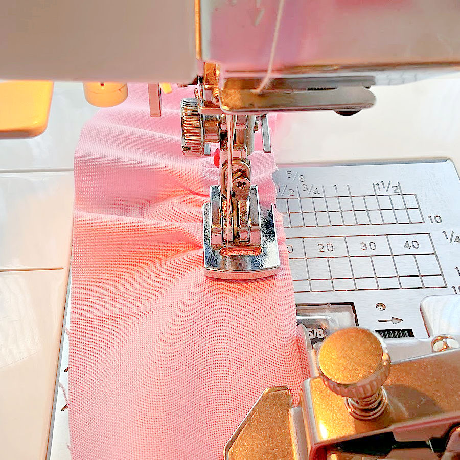 the gathering foot attached to a janome machine a magnetic seam guide in the image also