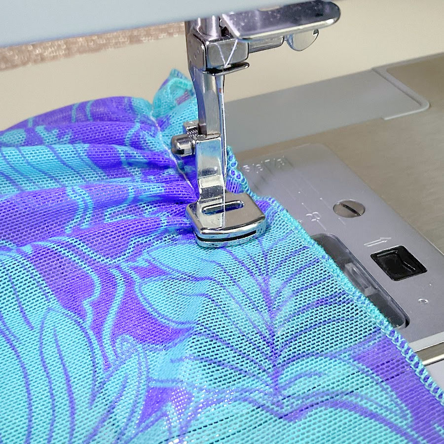 the gathering foot being used on a piece of stretch mesh fabric