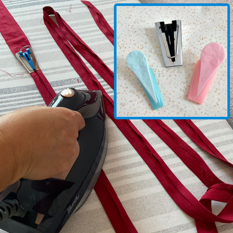 bias tape makers shown in the foreground in the background a womans hand ironing some bias tapes made with the tapemakers