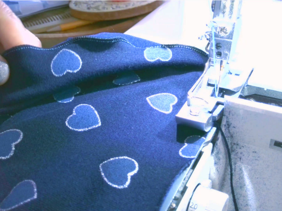 making the lettuce hem with the rolled hem function of the serger overlock