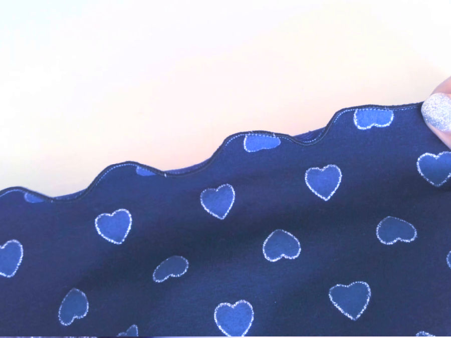 the hem of the shorts shown in detail lettuce hem