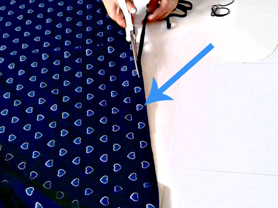 Image shows how to square up fabric using the printed pattern as a guide
