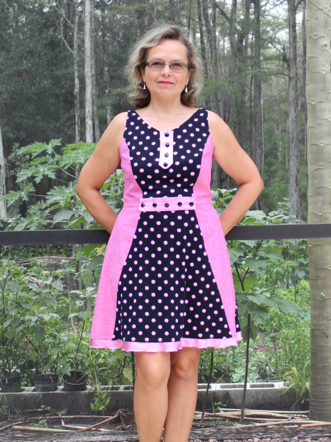 a woman wearing a dress made with a combination of woven and knit materials