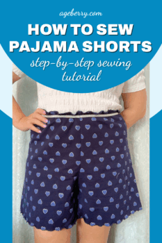 Beginner sewing tutorial on how to sew pajama shorts. Photo shows handmade navy pajama shorts with a silver waistband and scalloped hem, worn with a white smocked top. Text overlay says “How to Sew Pajama Shorts – step-by-step sewing tutorial.”