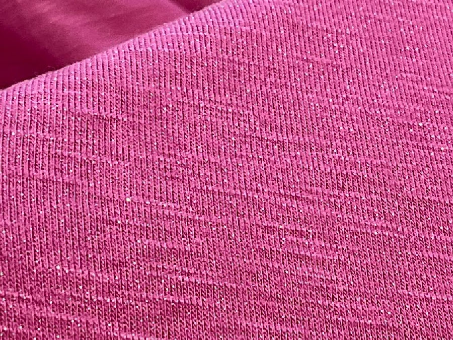 a piece of knit fabric where the loops are very small and difficult to see with the naked eye