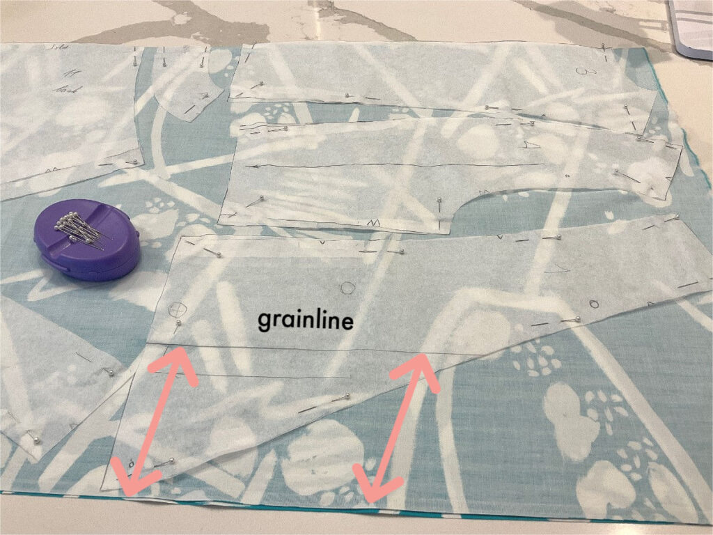 grainline marked on a pattern before cutting for proper alignment of the pattern pieces on the fabric