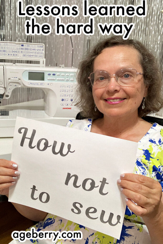 A smiling woman sits in front of a Janome sewing machine holding a sign that says “How not to sew.” The background has metallic curtains, and the text above reads, “Lessons learned the hard way.”