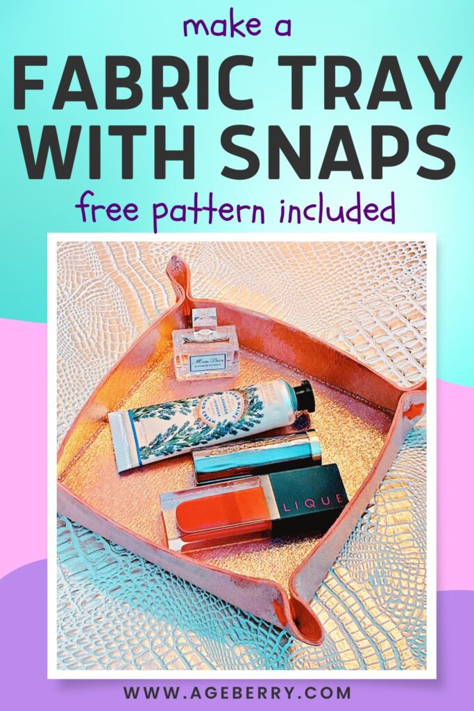 Handmade fabric tray with snap corners, displayed holding small items like perfume, hand cream, and lipstick.