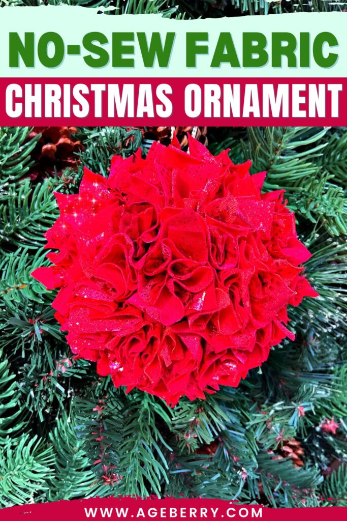 Handmade no-sew fabric Christmas ornament made from layered red fabric pieces shaped into a ball, hanging on a green Christmas tree.