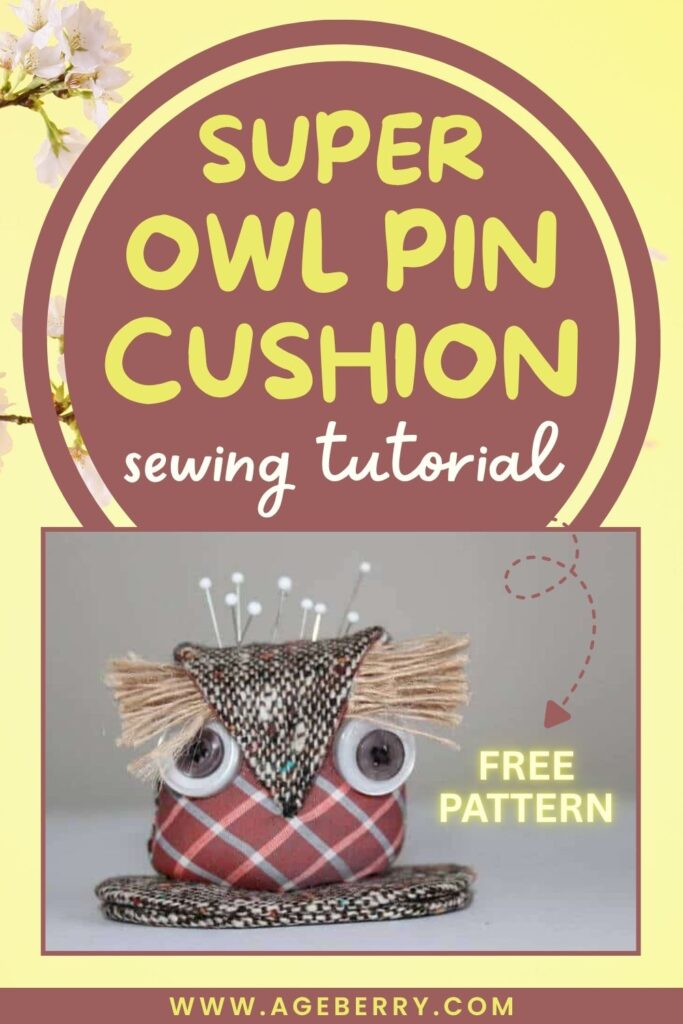 DIY owl-shaped pin cushion made from plaid and textured fabric, with button eyes and fringe tufts for ears. Sewing pins are stuck on top.