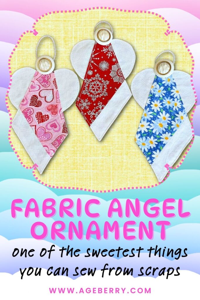 Three handmade fabric angel ornaments crafted from colorful fabric scraps—pink with hearts, red with snowflakes, and blue with daisies—each featuring white wings and a gold halo loop.