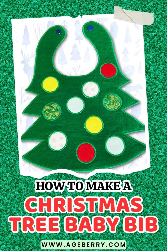 Green felt baby bib shaped like a Christmas tree, decorated with colorful circle “ornaments” in red, yellow, white, and green. The bib has snap closures at the top and is displayed on a festive green glitter background.