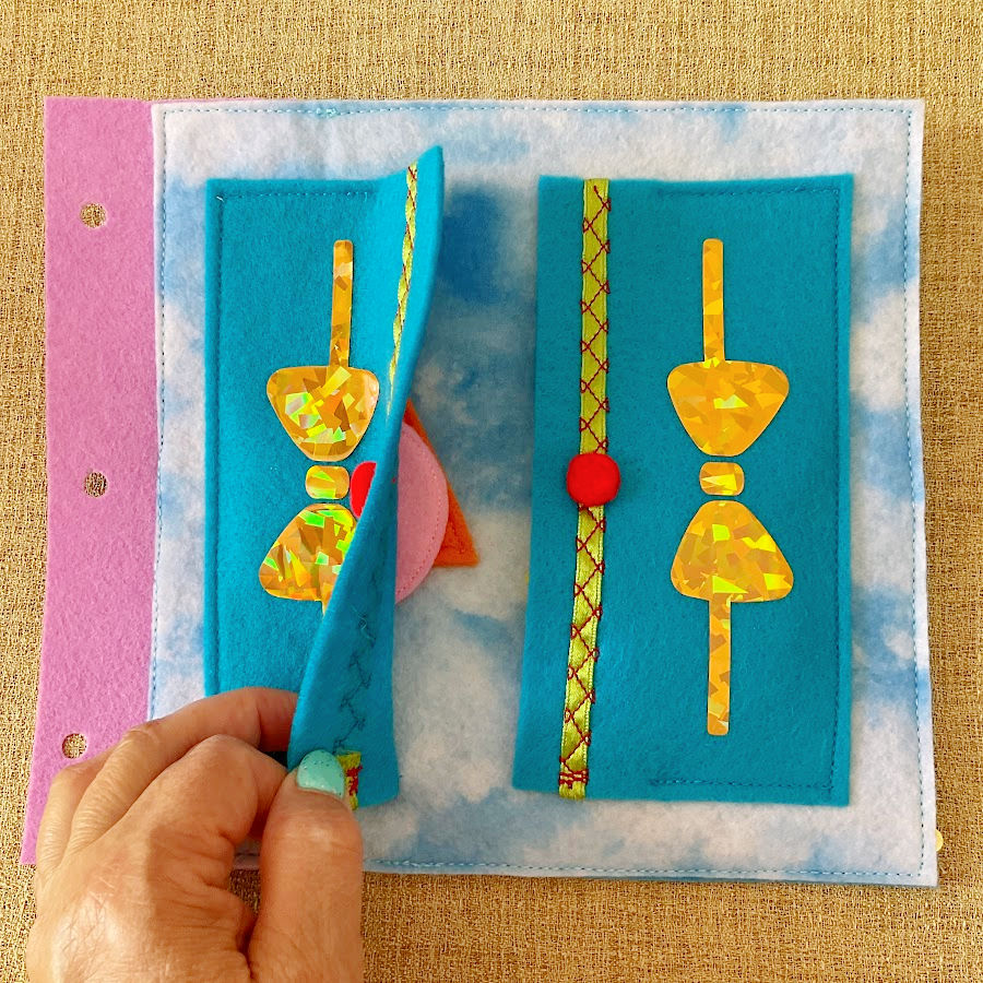 a cabinet page of the quiet book with pockets for storing the geometric shapes to be fit on a different page