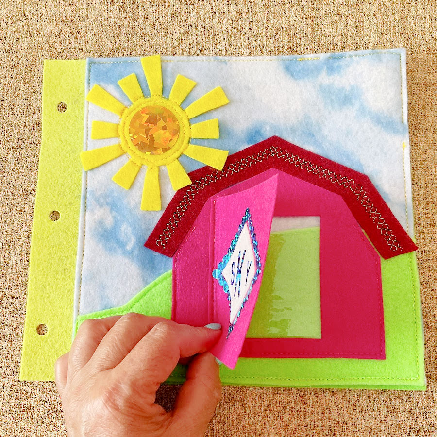 the cover of the quiet book which shows an empty pocket which will hold the image of the toddler owner