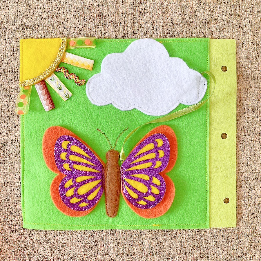 Butterfly on a page of the quiet book with the wing attached where it belongs