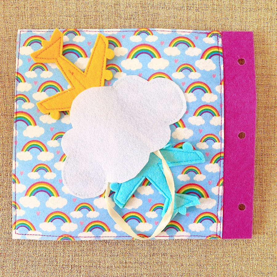 a pagr of the quiet book showing two airplanes flying and going under a cloud