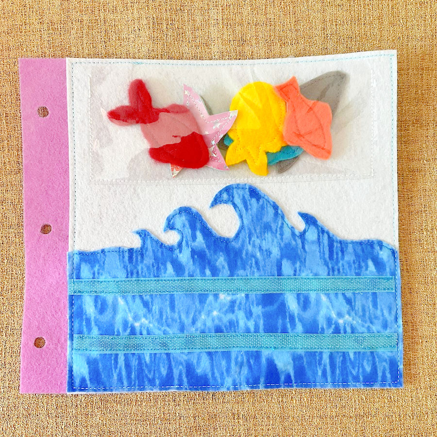 a page of the quiet book showing the sea with a number of marine animals above the water