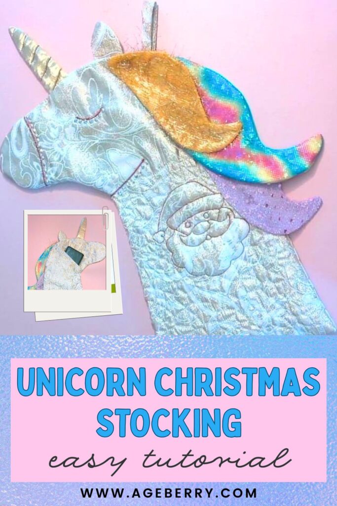 A shimmering unicorn-shaped Christmas stocking made from metallic fabric, featuring a gold, rainbow, and purple mane with an embroidered Santa design on the side.