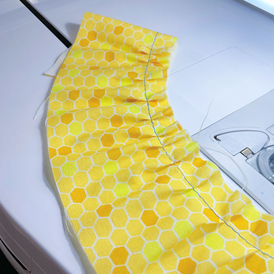 fabric gathered by tweezers