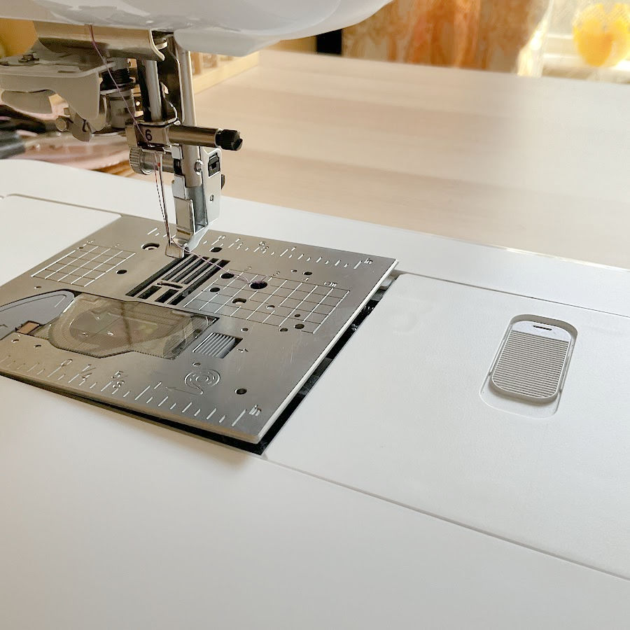 throat plate of the brother luminaire sewing and embroidery machine pops up with the push of a button