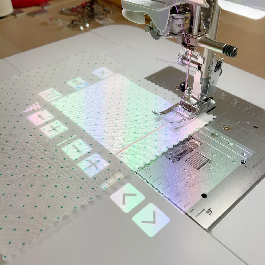 brother luminaire sewing and embroidery machine projects a line on the fabric where the stitch will go