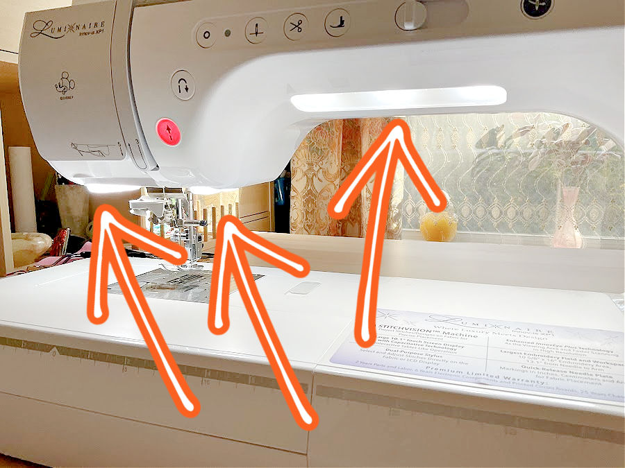 image of the brother luminaire sewing machine with arrows pointing to the very bright areas where led lights are