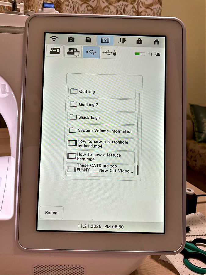 the screen for choosing video to play on a brother luminaire sewing and embroidery machine
