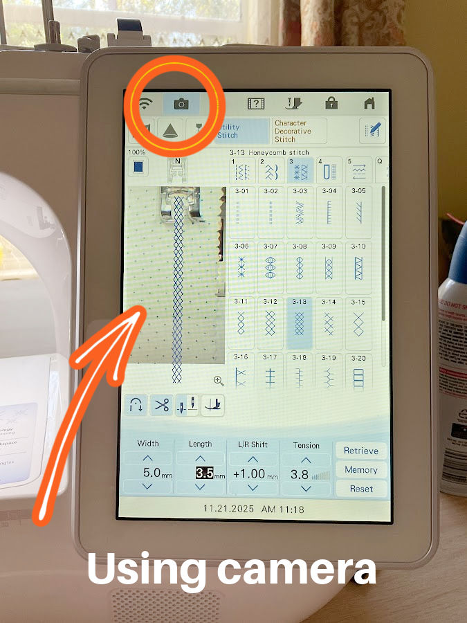 screenshot of the brother luminaire screen showing a piece of fabric and a superimposed seam the camera function is highlighted with a red circle