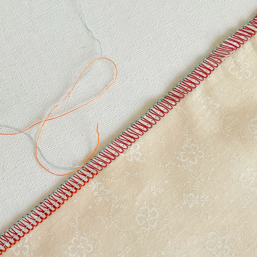 both needle threads removed from the seam the looper thread is ready to be removed