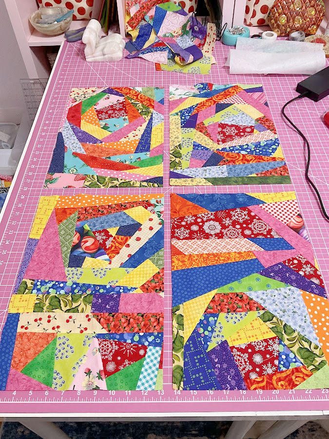 four rectangular crumb blocks presented on a sewing table ready to be sewn together