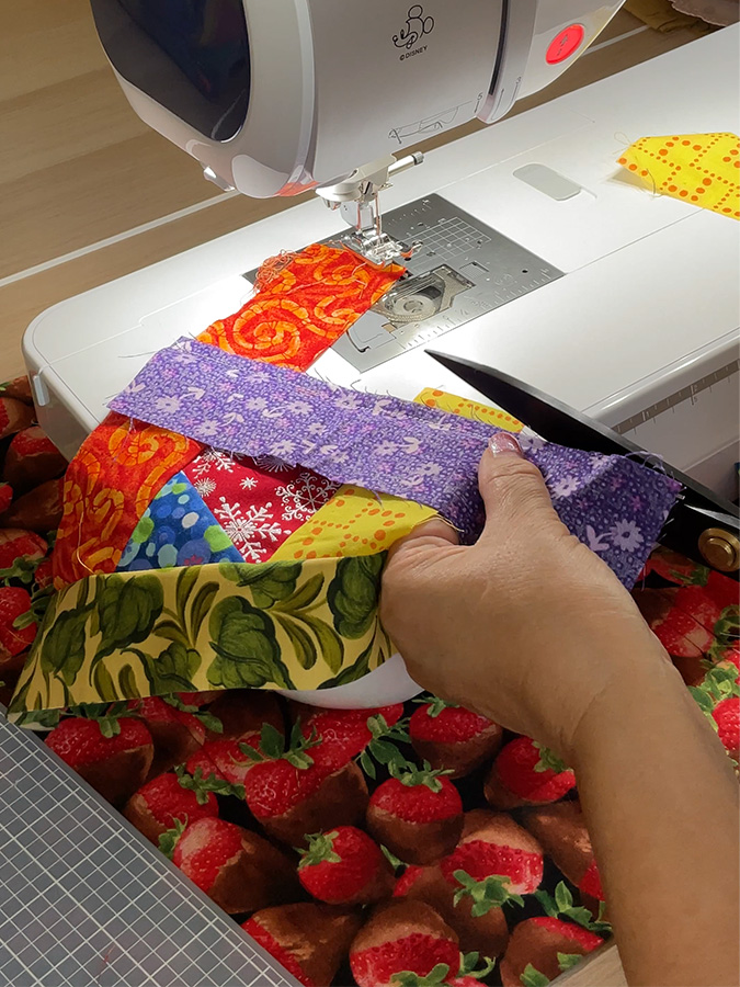 trimming the seam to about seam allowance size 1/4" as more pieces are added to the patchwork